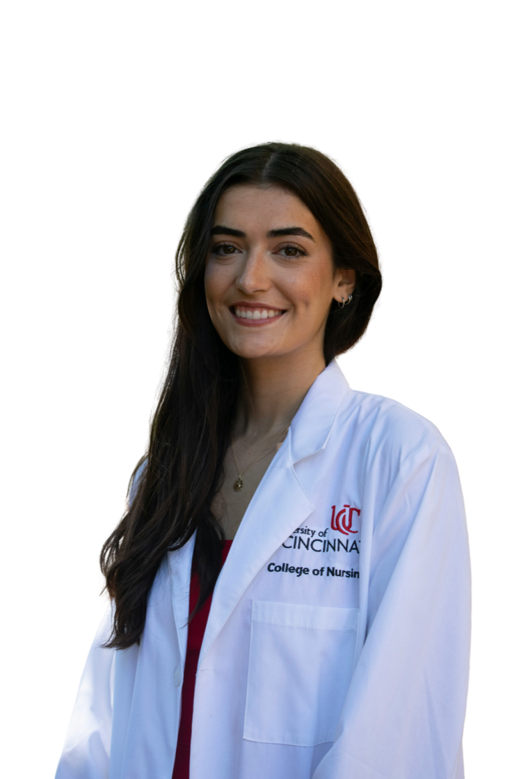 A nursing student in a white coat, smiling